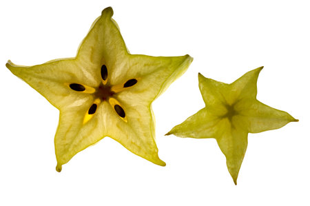 Slice of starfruit on white background