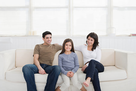 Hispanic parents with daughterの写真素材