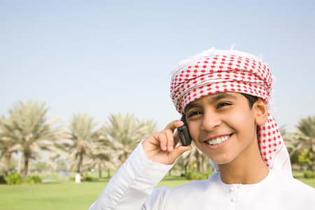 A boy using a cell phoneの写真素材