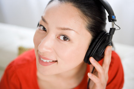 Japanese woman listening to musicの写真素材