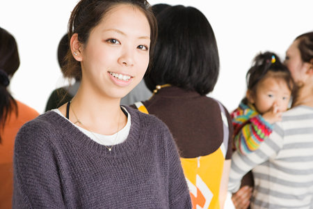 Young woman in group of peopleの写真素材