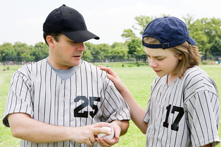 Father and son with baseballの写真素材
