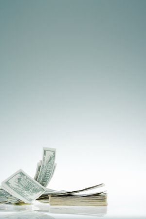Banknotes blowing awayの写真素材