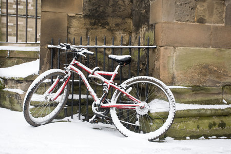 Bicycle leaning against stone wall, Warwickの写真素材