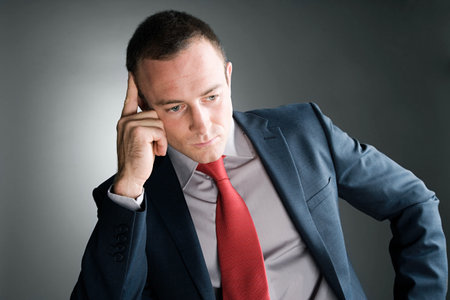 Thoughtful looking businessmanの写真素材