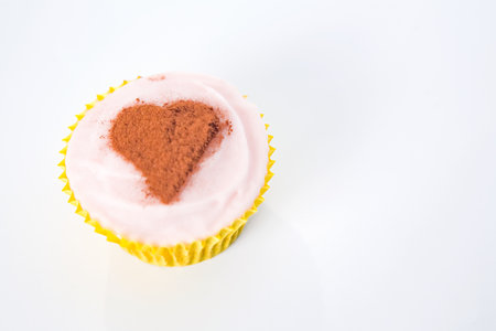 Heart shape on cupcakeの写真素材