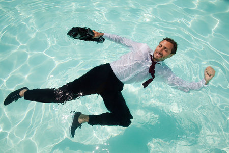 Businessman in swimming poolの写真素材
