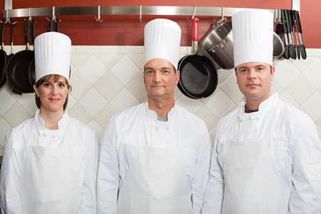 Chefs in commercial kitchen, portraitの写真素材