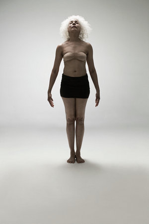 Mature woman standing, full lengthの写真素材