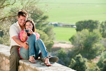 Young couple photographing themselvesの写真素材