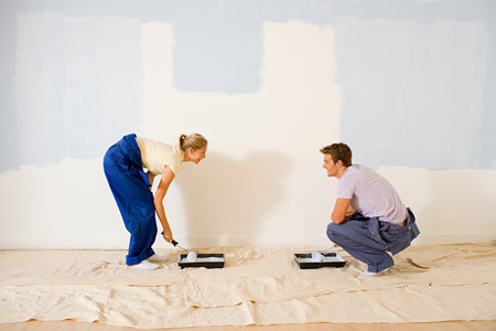 Young couple decoratingの写真素材