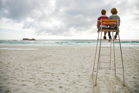 Two boys on lifeguard towerの写真素材