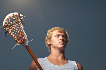 Lacrosse player with lacrosse stickの写真素材