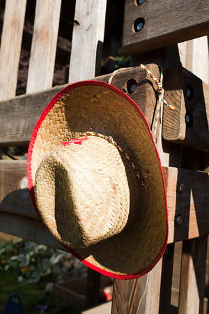 Cowboy hat hanging on wooden fenceの写真素材