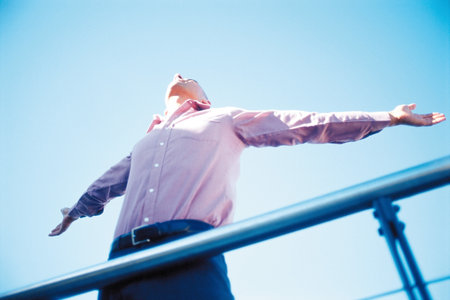 Businessman with outstretched armsの写真素材