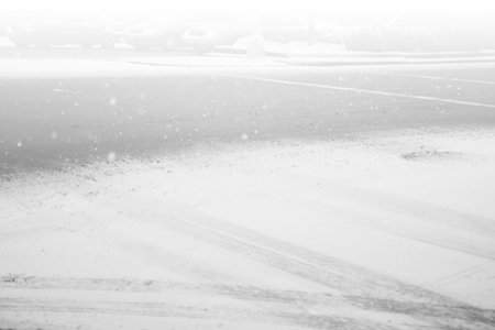 Snow falling on streetの写真素材