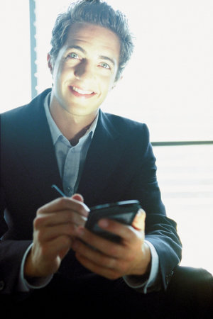 Businessman with palmtopの写真素材