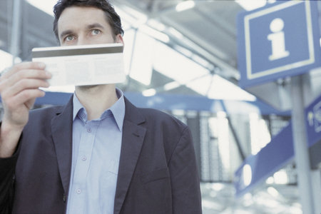 Businessman checking airline ticketの写真素材