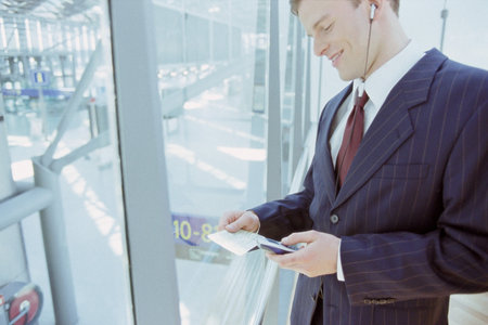 Businessman checking airline ticketの写真素材