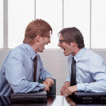 Two businessmen shouting at each other