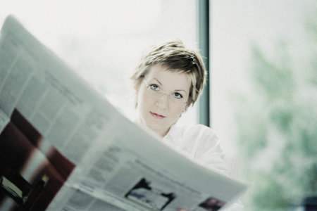 Businesswoman reading paperの写真素材