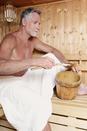 Man relaxing in saunaの写真素材