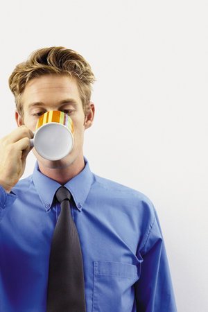 Businessman drinking a cup of teaの写真素材