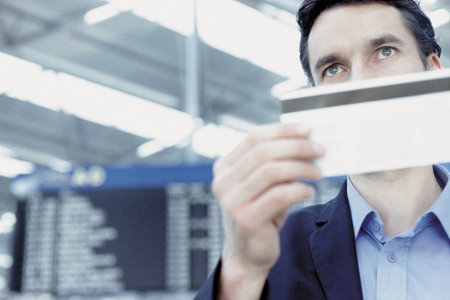 Businessman checking airline ticketの写真素材