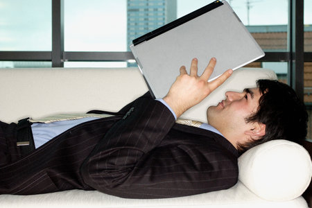 Businessman holding laptop computerの写真素材