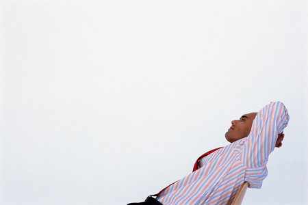 Satisfied businessman relaxingの写真素材