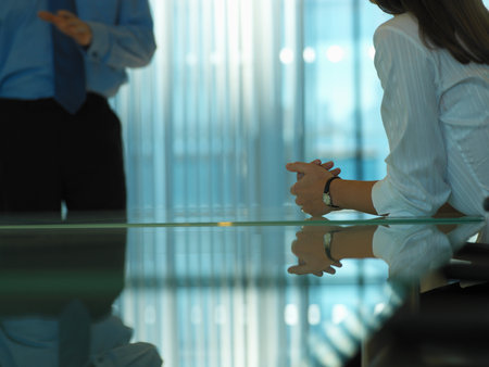Man and woman in a meeting roomの写真素材