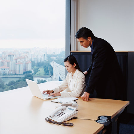 Two business people in officeの写真素材
