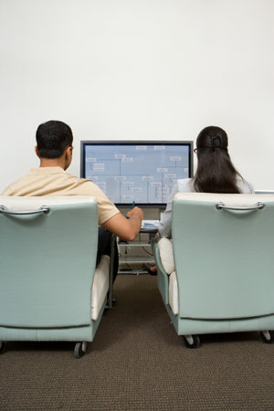 Colleagues watching presentation
