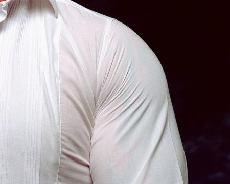 Man wearing very tight shirtの写真素材