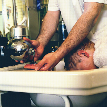 Boy at barbers shopの写真素材