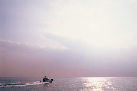 Fishing boat on oceanの写真素材