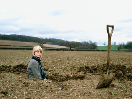 Farmer inside a holeの写真素材