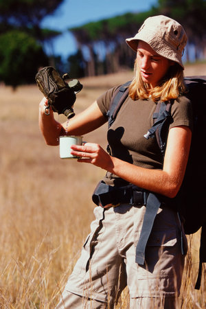 Woman having a drink on a safariの写真素材