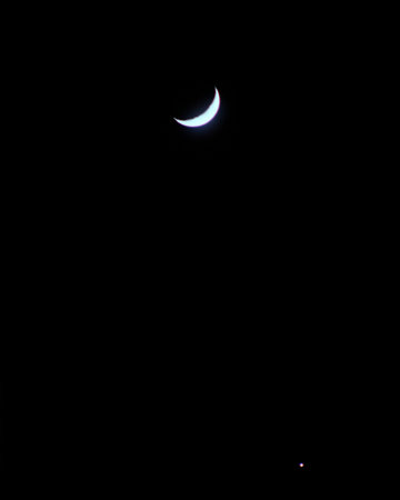 Crescent moon in skyの写真素材