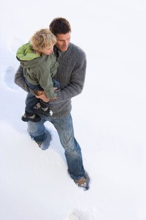 Father and son in snowのeditorial素材