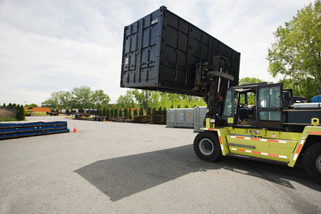 Forklift truck with cargo containerのeditorial素材