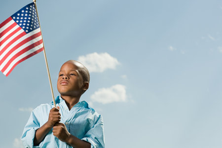 Boy with an american flagの写真素材
