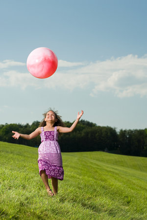 Girl with a ballの写真素材