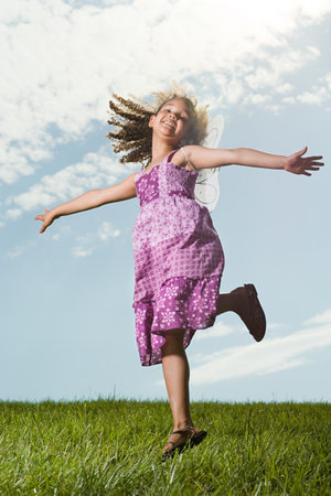 Girl jumping backgroundの写真素材