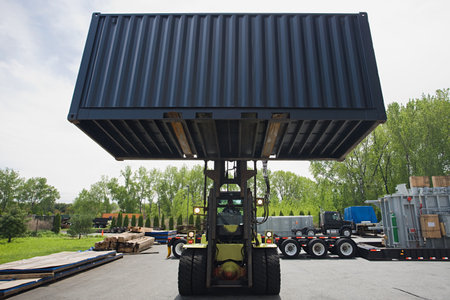 Fork lift truck with cargo container