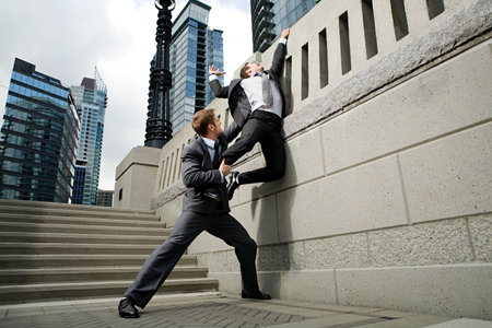 Businessman trying to escapeの写真素材