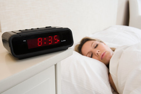 Woman asleep in bedの写真素材