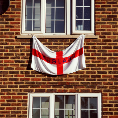 England flag hanging from a windowの写真素材