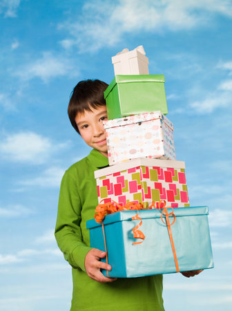 A boy carrying presentsの写真素材