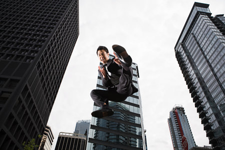 Businessman kickingの写真素材